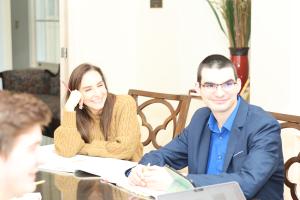 Piano pedagogy students around a conference table
