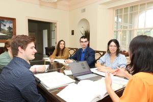piano pedagogy students around a conference table