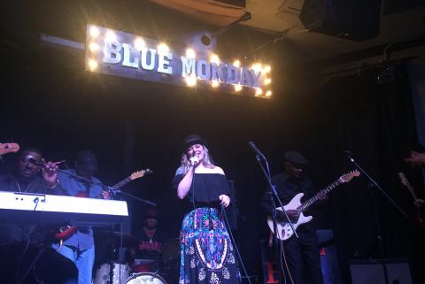 Nicole Needham singing at Blue Monday fundraiser