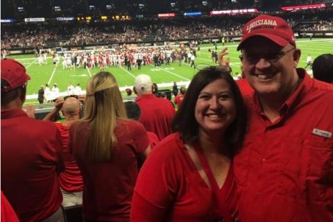 Jennifer Taylor and Spouse at UL Bowl Game